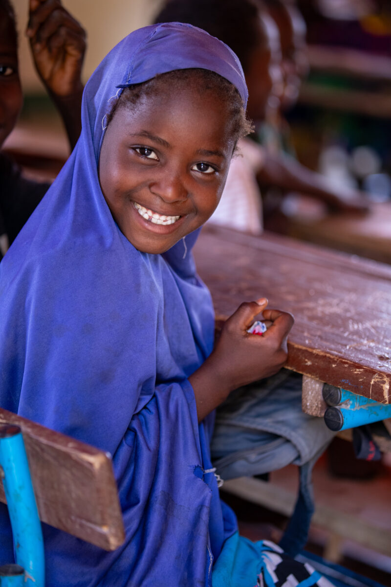 Girl in Niger Attends School — With a long tradition of early marriage, most girls in Niger drop out of school after the second grade — Africa, Child, Comple...