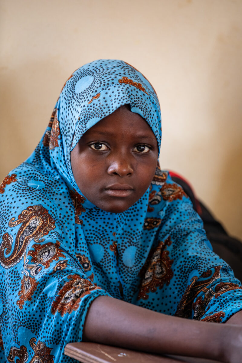 Girl in Niger Attends School — With a long tradition of early marriage, most girls in Niger drop out of school after the second grade — Africa, Close-Up, Edu...