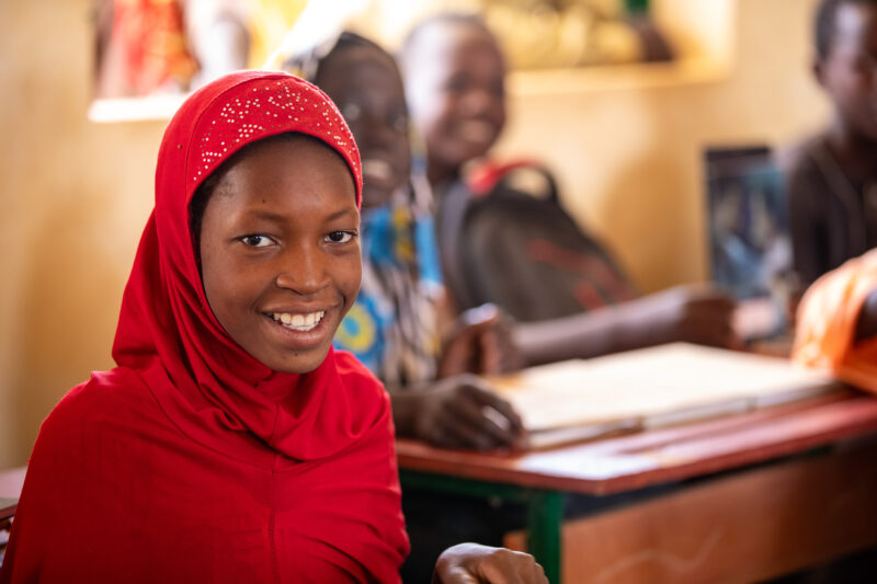 Girl in Niger Attends School — With a long tradition of early marriage, most girls in Niger drop out of school after the second grade — Adult, Africa, Educat...