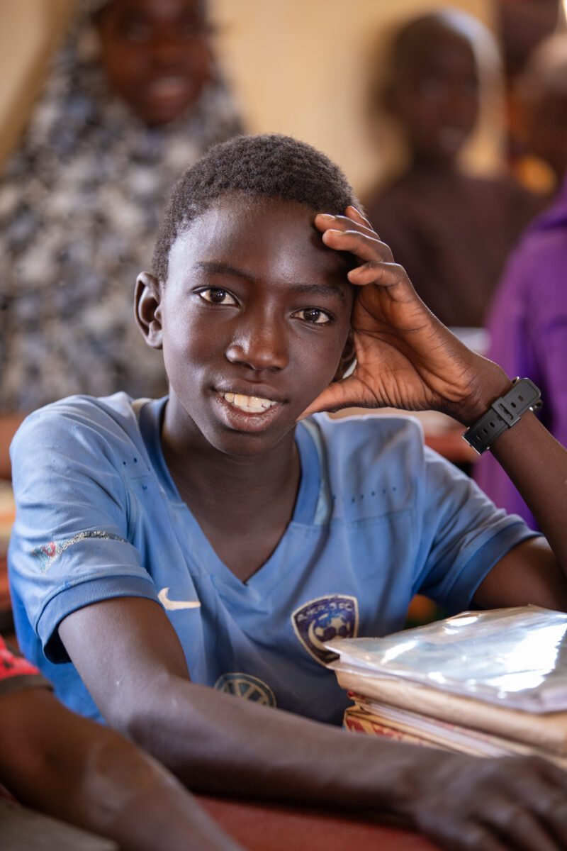 Boy in School in Niger — Young boy attends school in Niger, Africa — Africa, Education, Eyes Open, Frontal Face, Male