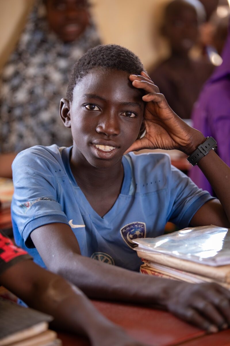 Boy in School in Niger — Young boy attends school in Niger, Africa — Africa, Education, Eyes Open, Frontal Face, Male