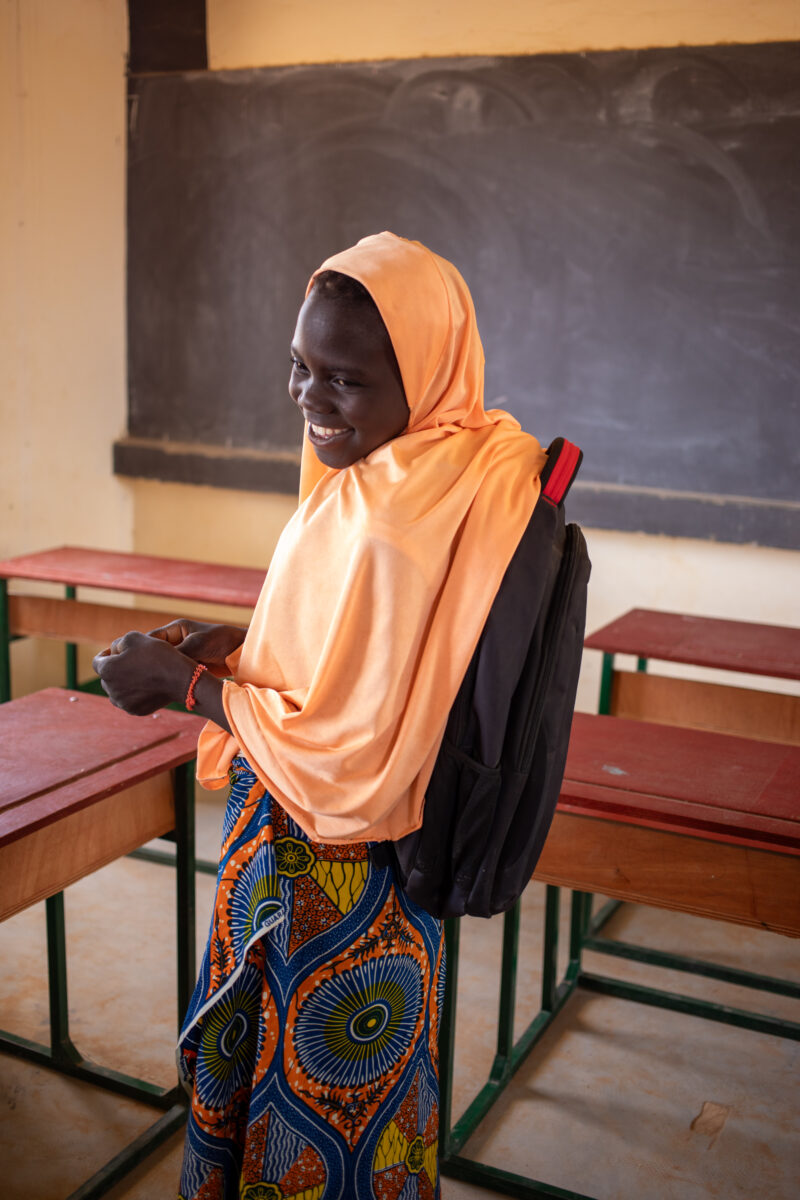 Girl in Niger Attends School — With a long tradition of early marriage, most girls in Niger drop out of school after the second grade — Adult, Africa, Educat...