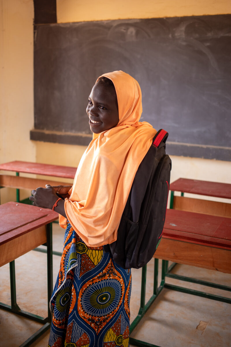 Girl in Niger Attends School — With a long tradition of early marriage, most girls in Niger drop out of school after the second grade — Adult, Africa, Educat...