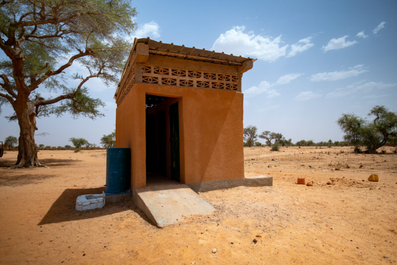 School Sanitation in Niger — Outhouse Toilets make it easier for Children to attend school in Niger, Africa. — Africa, Architecture, Building, Desert, Education