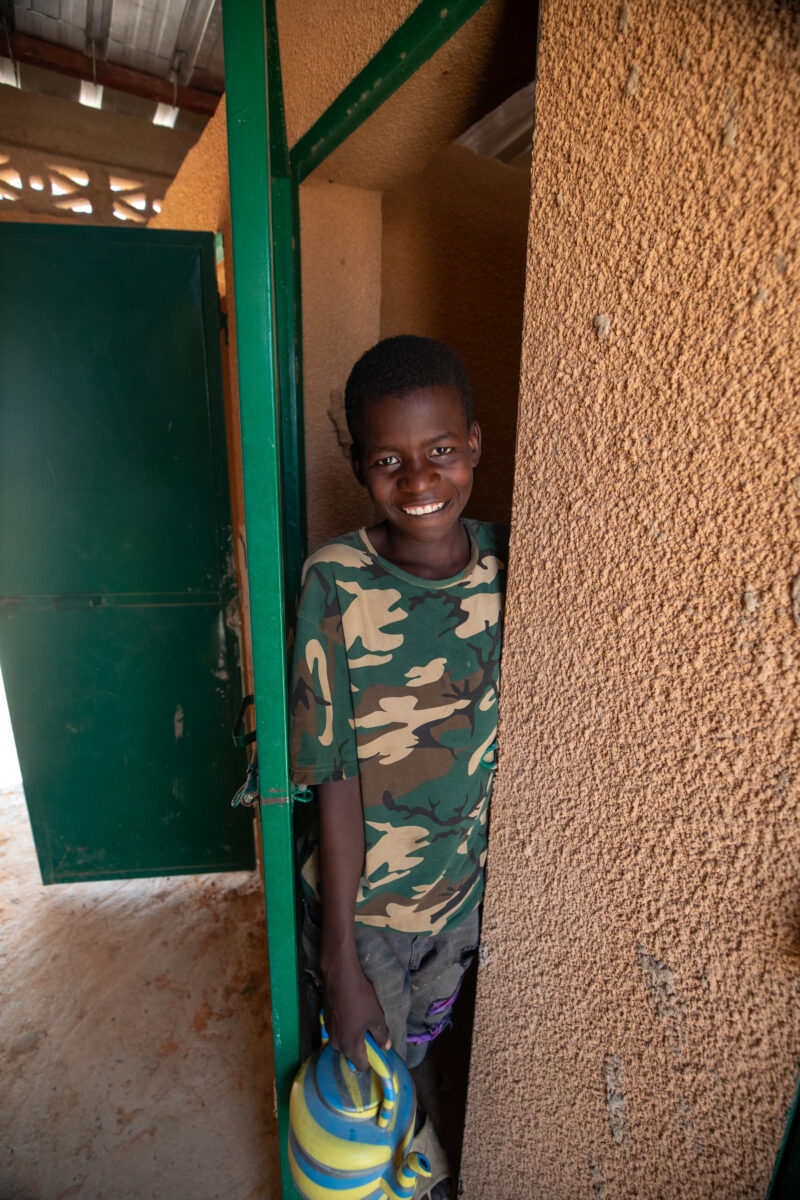 Comfort Rooms in Niger — Students appreciating the Toilets at theit new school in Niger, Africa. — Africa, Education, Eyes Open, Frontal Face, Male