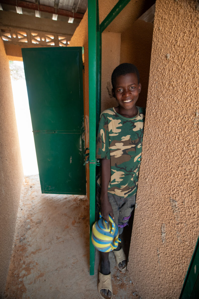 Comfort Rooms in Niger — Students appreciating the Toilets at theit new school in Niger, Africa. — Africa, Education, Eyes Open, Frontal Face, Male