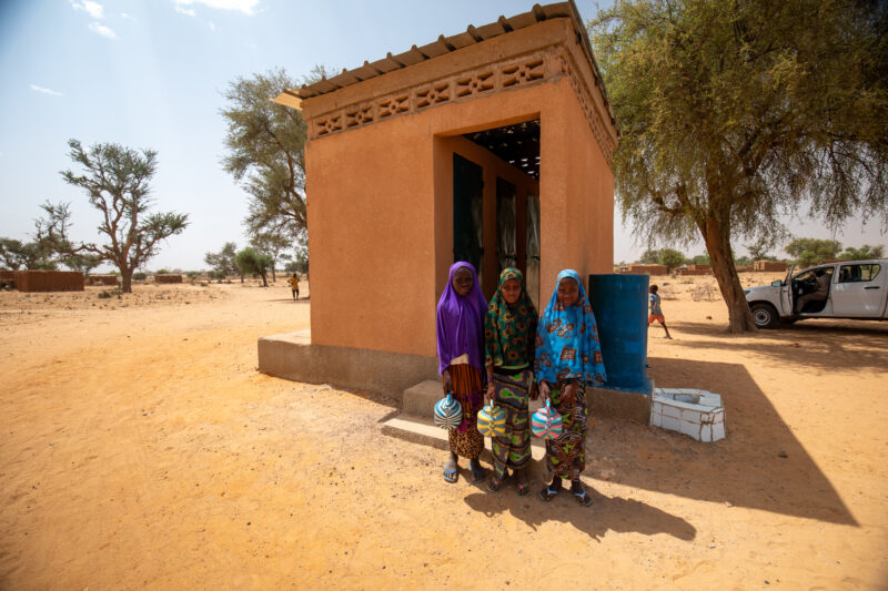 Comfort Rooms in Niger — Students appreciating the Toilets at theit new school in Niger, Africa. — Adult, Africa, Architecture, Building, Desert
