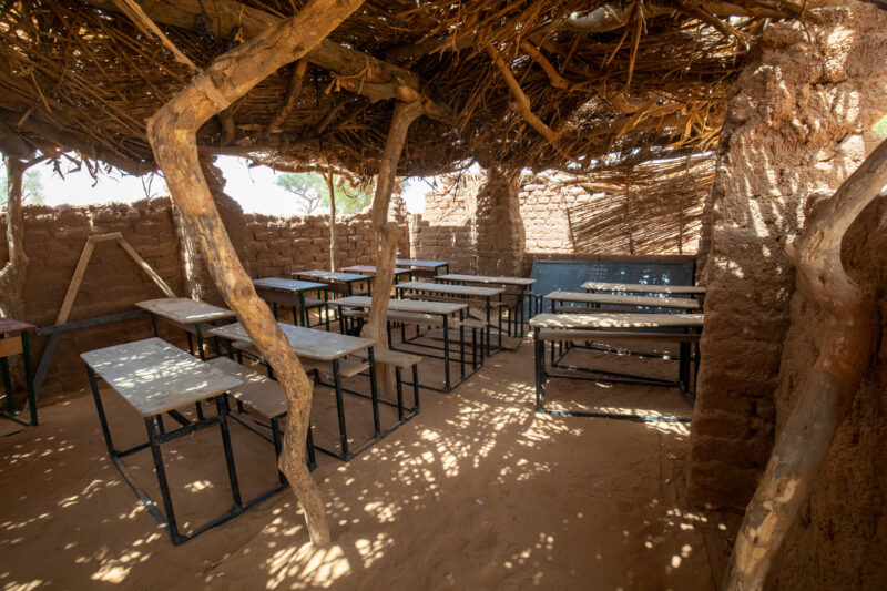 Temporary Classroom — Students in Niger, Africa, attend school in a classroom made of mud and sticks. — Africa, Education, Niger, Sepia Tones, Temporary Clas...