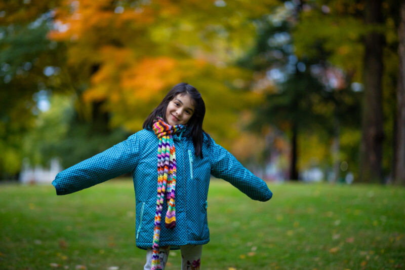 Loving the Fall — Young girl enjoys the scenic beauty of the fall. — Tree, Trees, Fall, Autumn, leaves