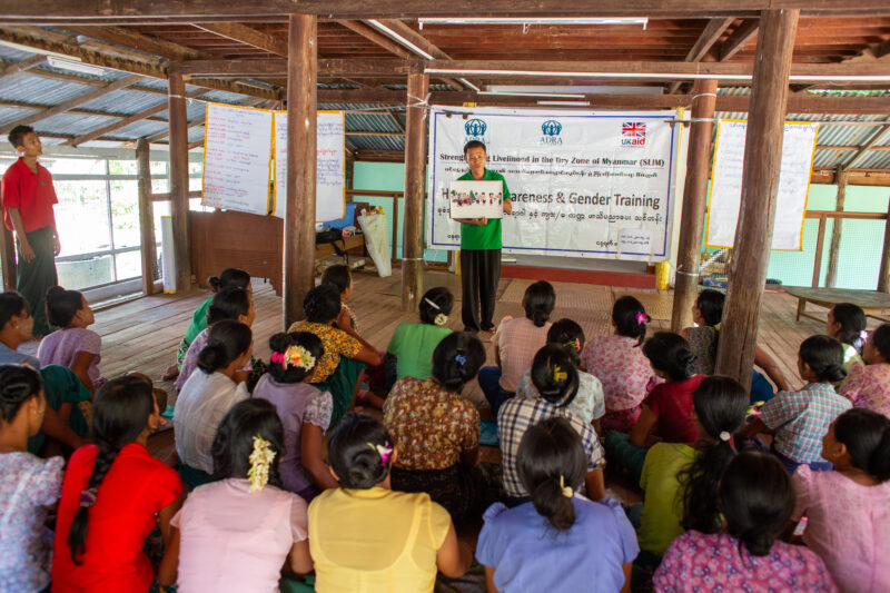 Health Education — Rural community group attends Adult education in health and income generating enterprises. — Adult, Eyes Open, Frontal Face, Male, One Face