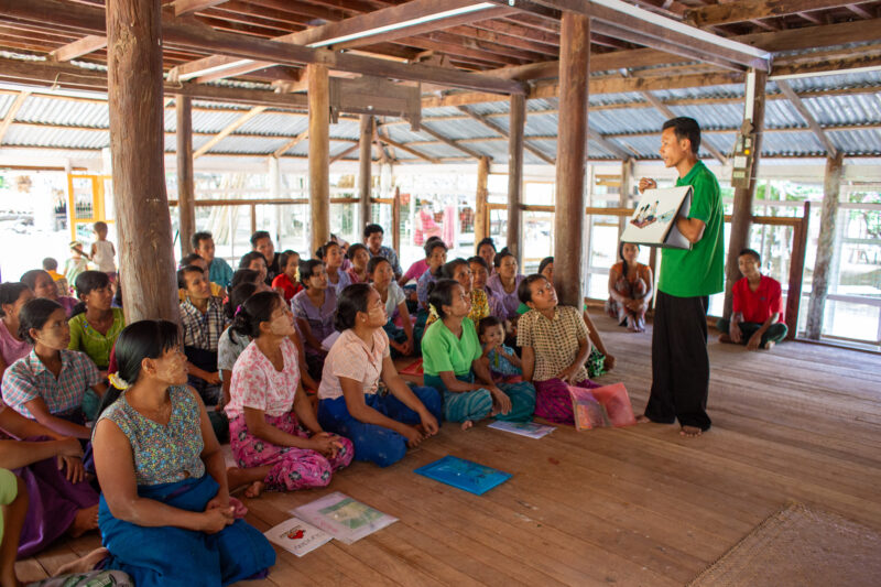 Health Education — Rural community group attends Adult education in health and income generating enterprises. — Adult, Architecture, Beard, Building, Eyes Cl...