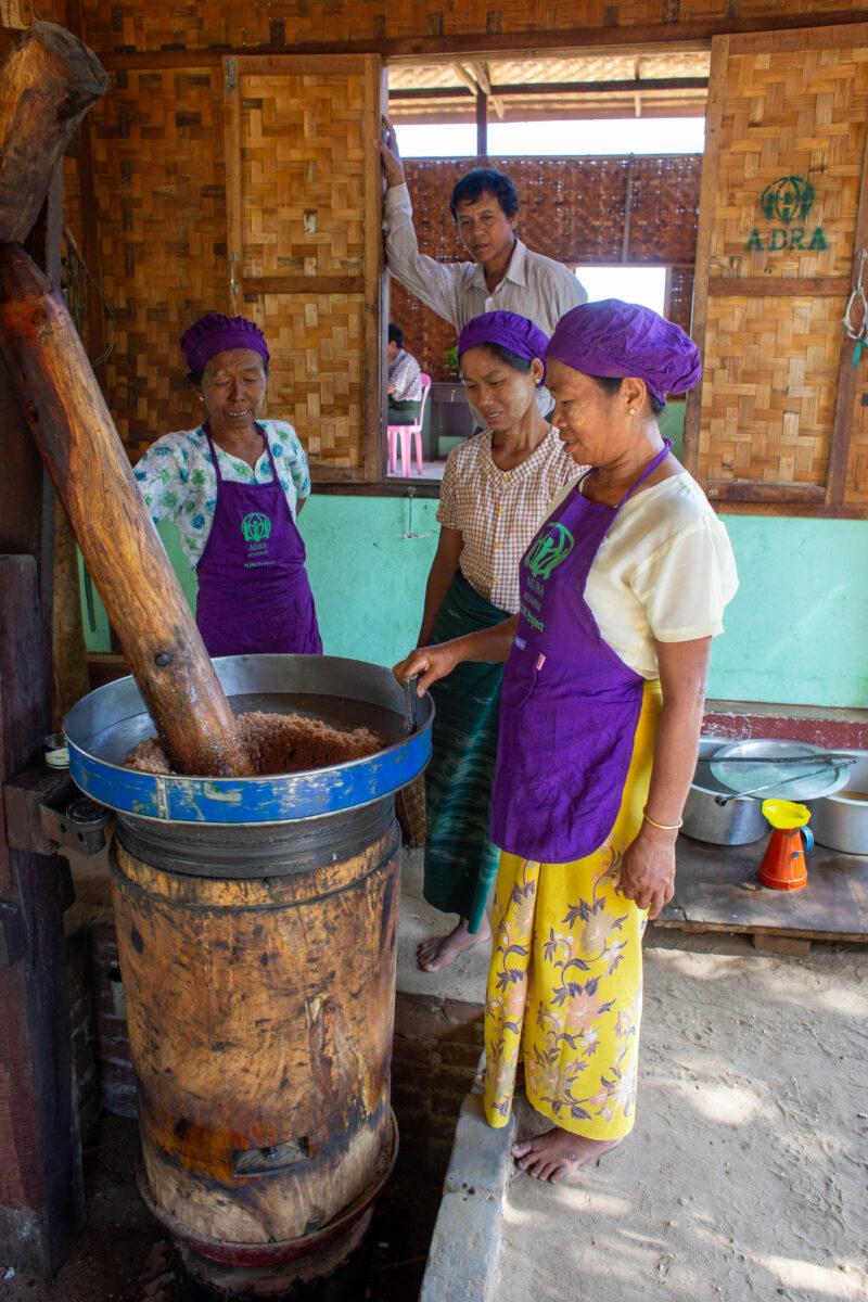 Peanut Butter Grinding — People in rural Myanmar learn new ways to make income through food processing. — Adult, Eyes Closed, Eyes Open, Female, Frontal Face