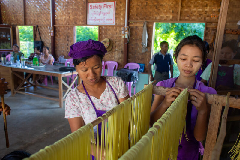 Making Spaghetti — Community income group learn how to make spaghetti as a new way to make income. — Adult, Beard, Eyes Closed, Female, Frontal Face