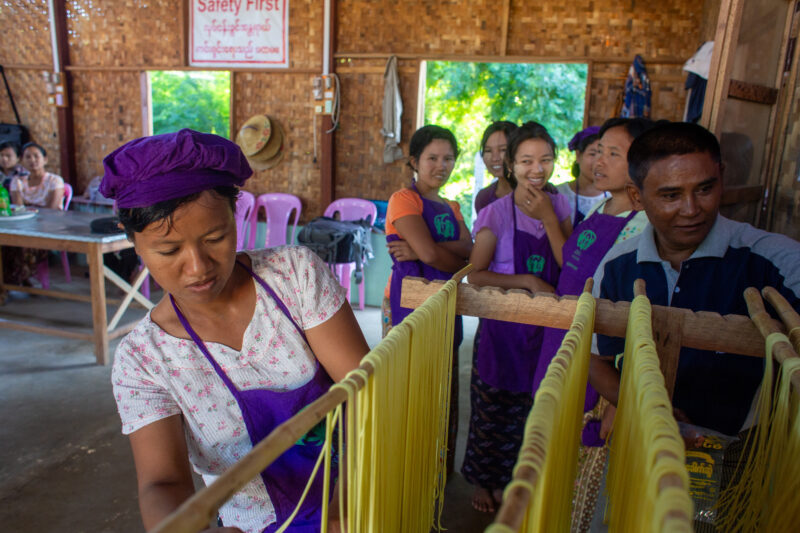 Making Spaghetti — Community income group learn how to make spaghetti as a new way to make income. — Adult, Eyes Closed, Eyes Open, Female, Frontal Face
