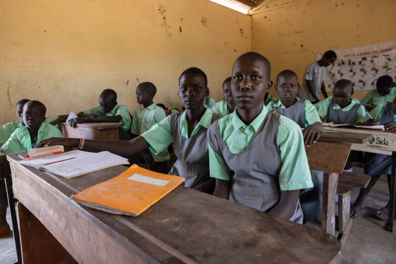 Happy to Be In School — Youn girls in South Sudan Africa are going back to school — Adult, Child, Eyes Closed, Eyes Open, Female