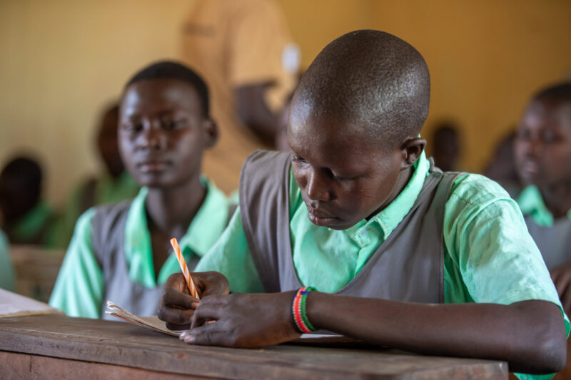 Happy to Be In School — Youn girls in South Sudan Africa are going back to school — Adult, Eyes Closed, Frontal Face, Male, One Face