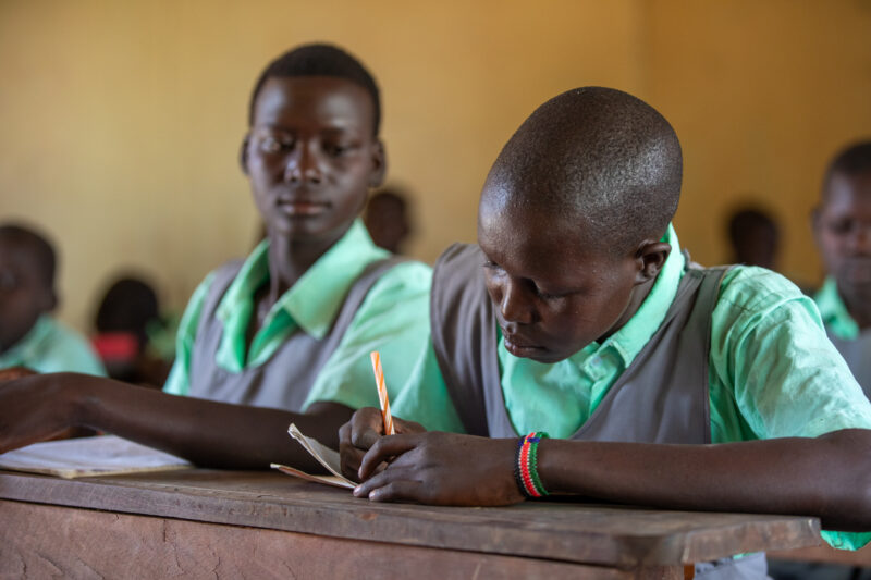 Happy to Be In School — Youn girls in South Sudan Africa are going back to school — Eyes Closed, Frontal Face, Male, One Face, Person