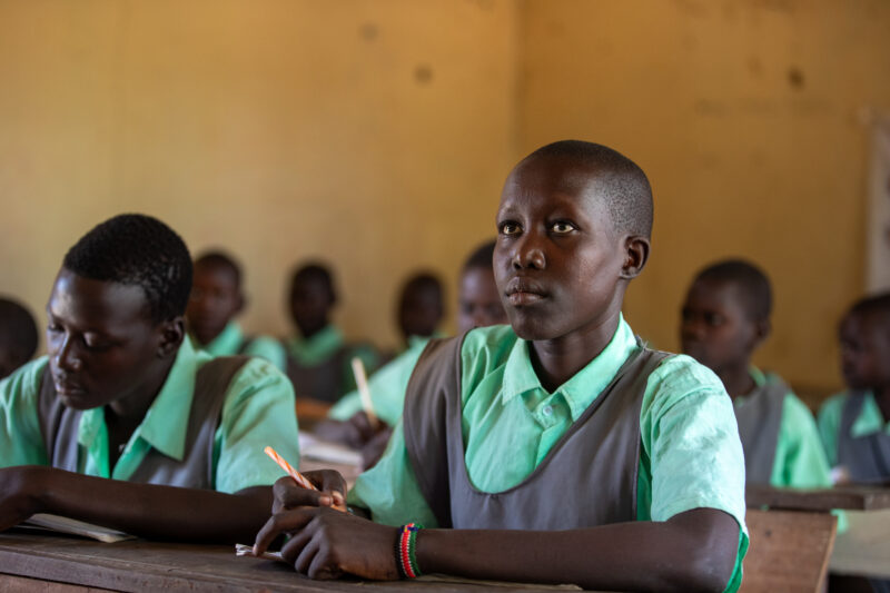 Happy to Be In School — Youn girls in South Sudan Africa are going back to school — Adult, Eyes Open, Frontal Face, Male, Person