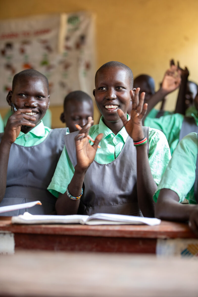 Happy to Be In School — Youn girls in South Sudan Africa are going back to school — Adult, Eyes Closed, Eyes Open, Female, Frontal Face