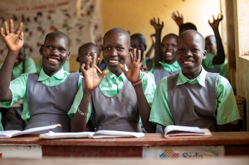 Happy to Be In School — Youn girls in South Sudan Africa are going back to school — Adult, Beard, Eyes Closed, Eyes Open, Frontal Face