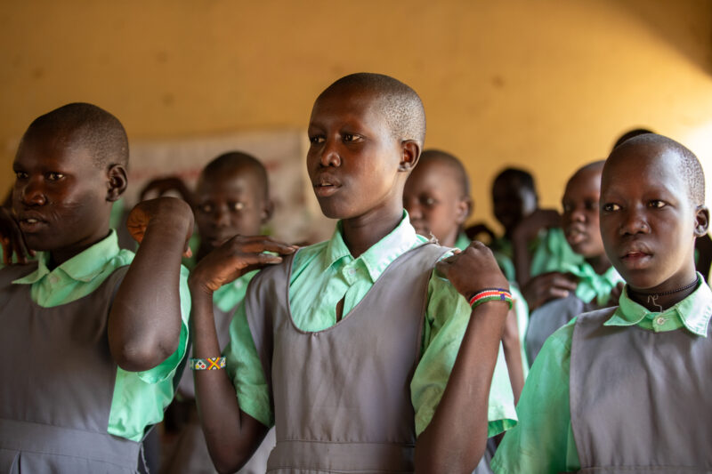 Happy to Be In School — Youn girls in South Sudan Africa are going back to school — Adult, Eyes Closed, Eyes Open, Frontal Face, Group