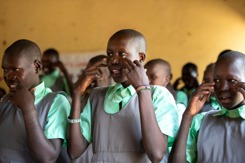 Happy to Be In School — Youn girls in South Sudan Africa are going back to school — Adult, Beard, Eyes Open, Frontal Face, Group