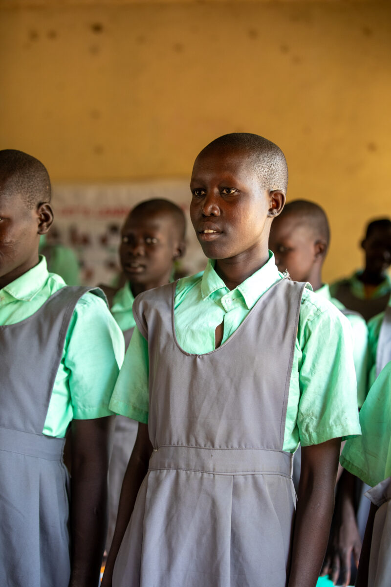 Happy to Be In School — Youn girls in South Sudan Africa are going back to school — Adult, Eyes Open, Frontal Face, Group, Male