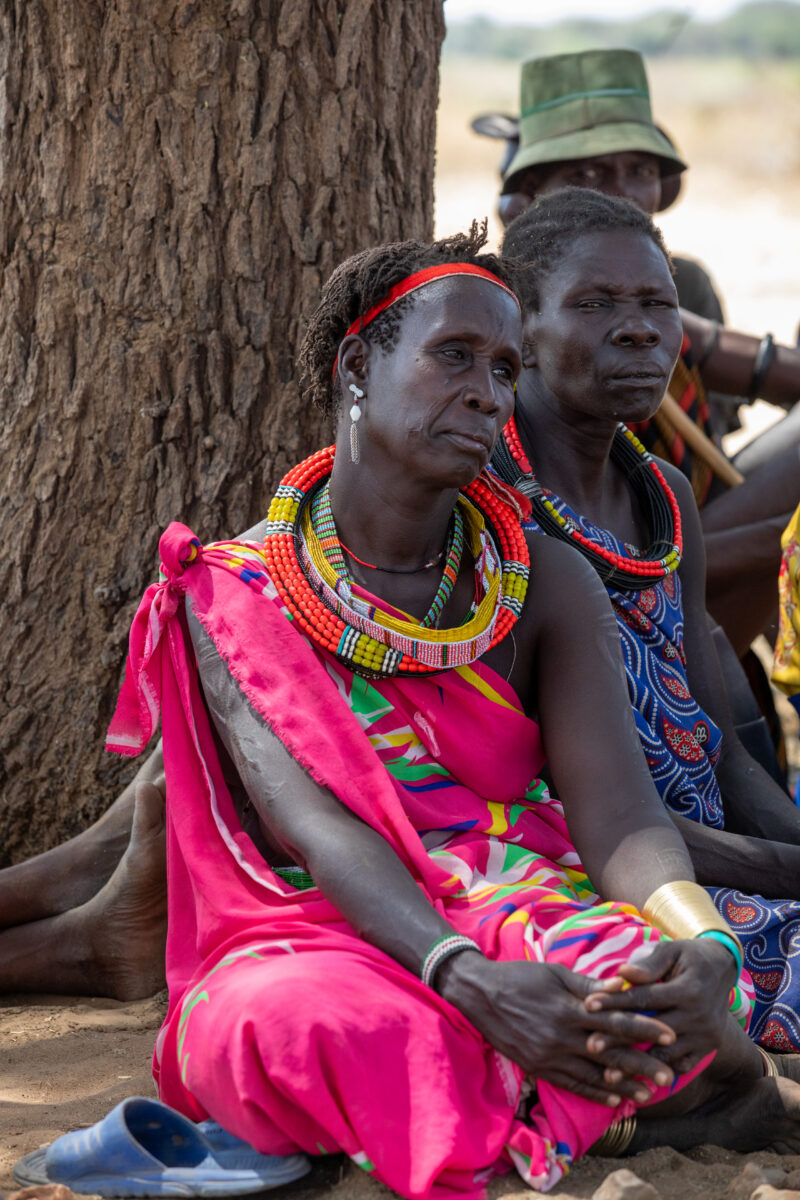 Adult Education — Adults under a tree gather for education on health, food security and income generation. — Adult, Beard, Eyes Open, Frontal Face, Male