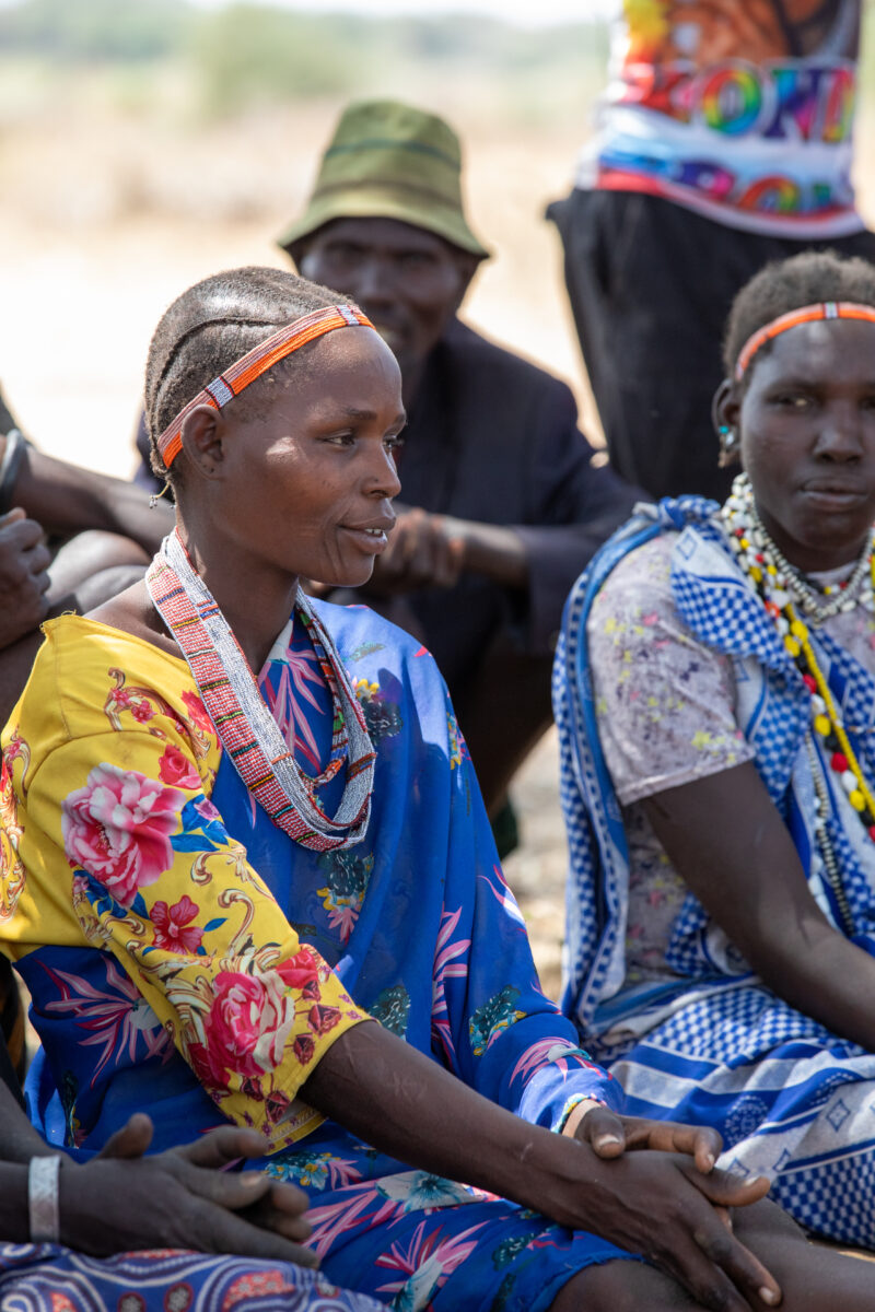 Adult Education — Adults under a tree gather for education on health, food security and income generation. — Adult, Beard, Eyes Open, Frontal Face, Male