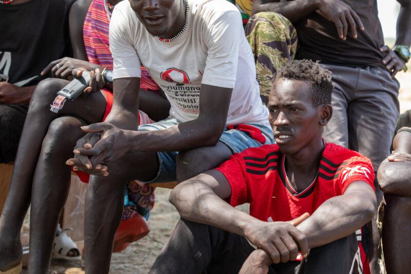 Adult Education — Adults under a tree gather for education on health, food security and income generation. — Adult, Beard, Boat, Eyes Open, Frontal Face