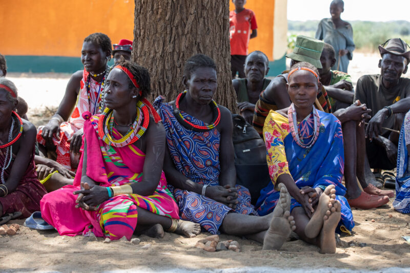 Adult Education — Adults under a tree gather for education on health, food security and income generation. — Adult, Beard, Eyes Open, Frontal Face, Group