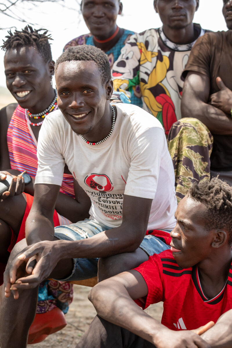 Adult Education — Adults under a tree gather for education on health, food security and income generation. — Adult, Boat, Eyes Open, Frontal Face, Group