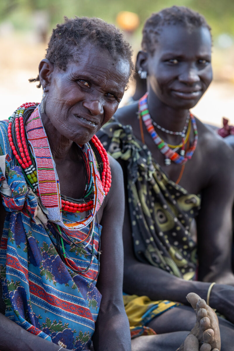 Adult Education — Adults under a tree gather for education on health, food security and income generation. — Adult, Beard, Eyes Open, Frontal Face, Male