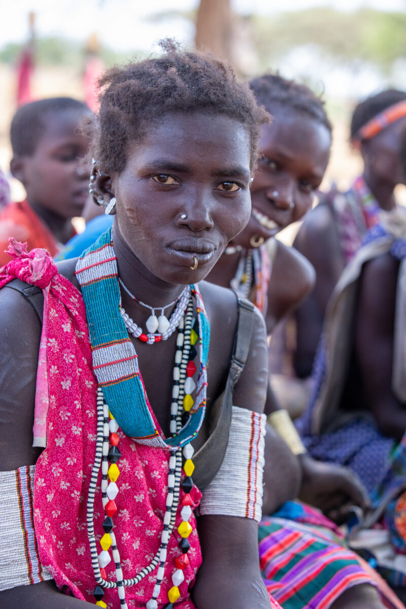 Adult Education — Adults under a tree gather for education on health, food security and income generation. — Adult, Eyes Closed, Eyes Open, Frontal Face, Group