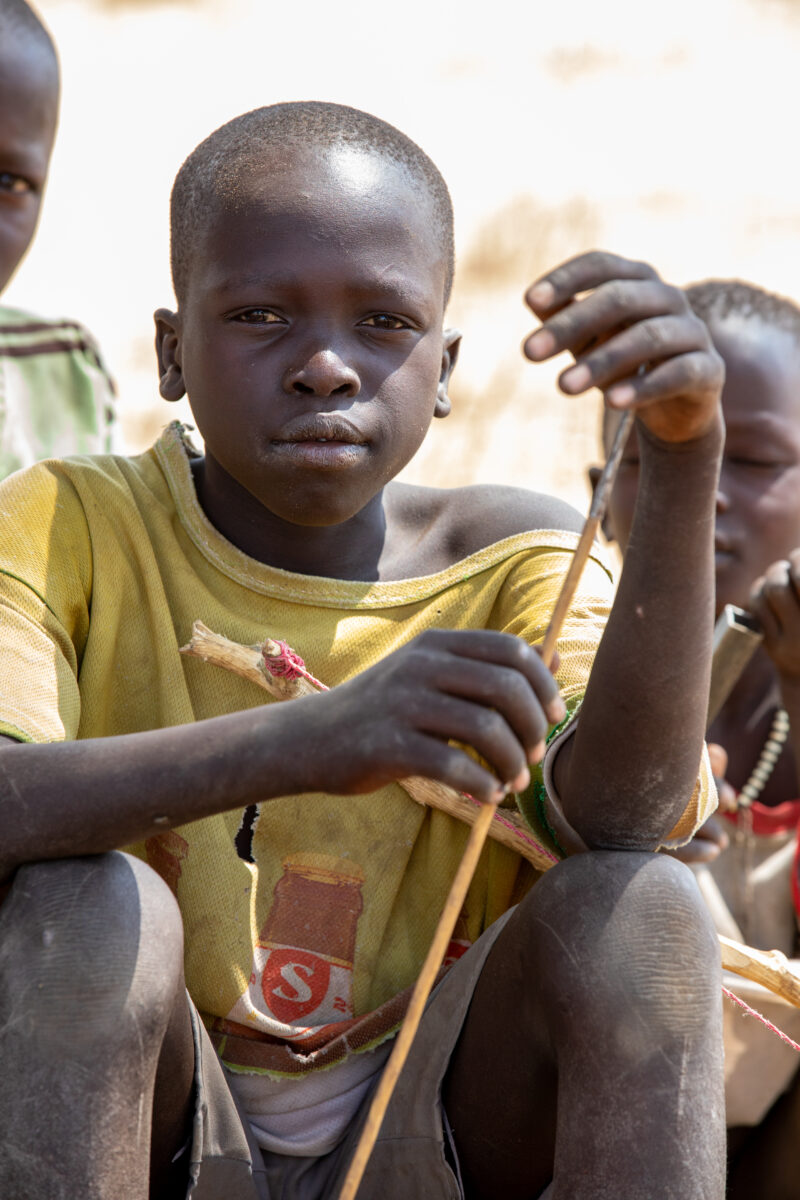 Children in South Sudan — Boat, Child, Eyes Open, Frontal Face, Male