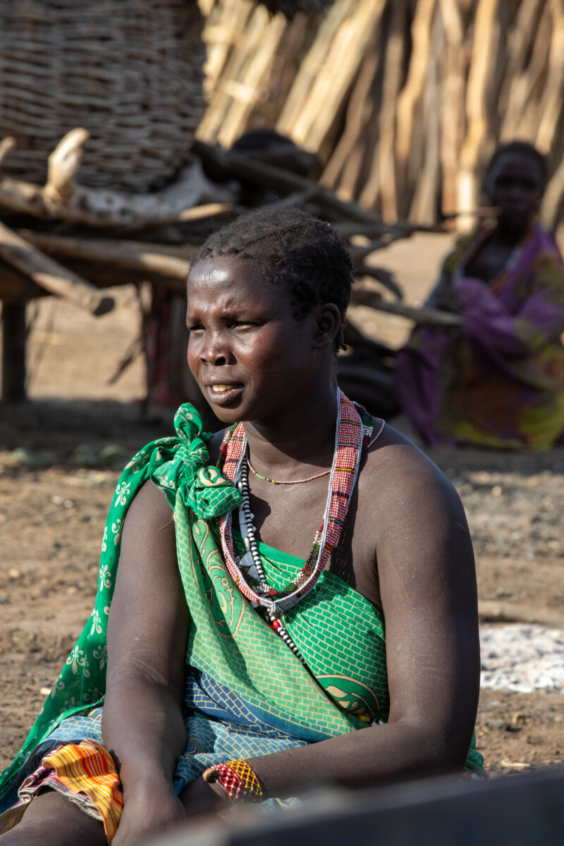 Women in South Sudan — Women of a rural village in South Sudan meet for the weekly meeting of a Savings and Loans group. — Adult, Frontal Face, Male, One Fac...