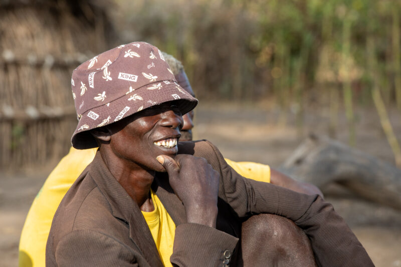 Men In South Sudan — Men of a rural village in South Sudan meet for the weekly meeting of a Savings and Loans group. — One Face, Person, Portrait, Profile Fa...