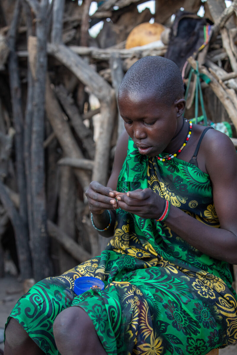 Bead Working in Africa — Young girl in South Sudan does beed work. — One Face, Person, Portrait, Profile Face, Africa