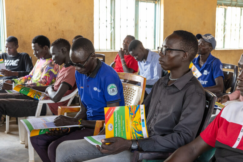 Teacher Training — Teachers go back to school to learn new methods of teaching in rural South Sudan. — Adult, Beard, Boat, Eyes Closed, Frontal Face