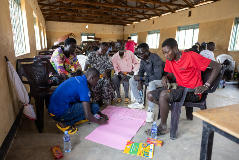 Teacher Training — Teachers go back to school to learn new methods of teaching in rural South Sudan. — Adult, Beard, Eyes Closed, Eyes Open, Female