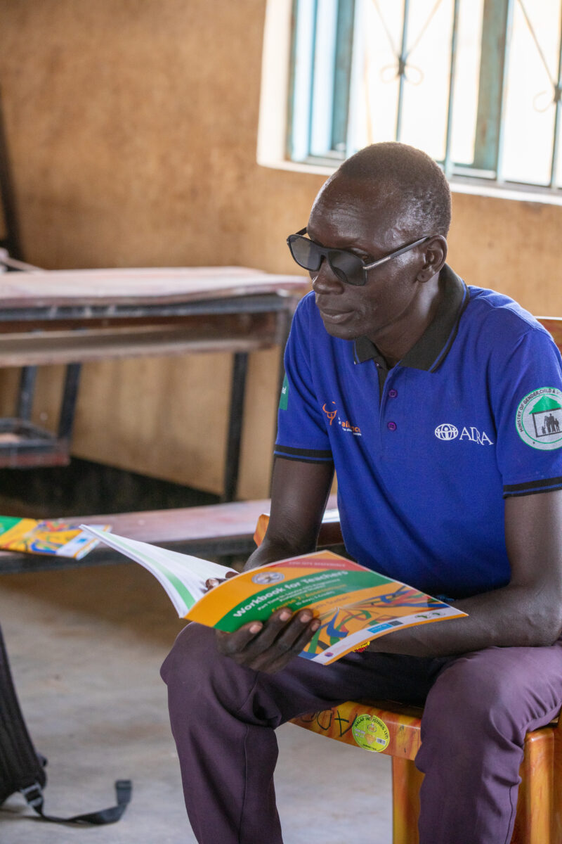 Teacher Training — Teachers go back to school to learn new methods of teaching in rural South Sudan. — Adult, Beard, Eyes Closed, Frontal Face, Glasses