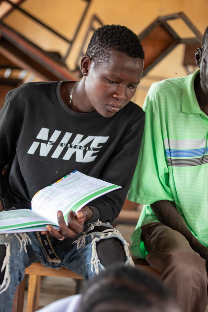 Teacher Training — Teachers go back to school to learn new methods of teaching in rural South Sudan. — Child, Eyes Closed, Frontal Face, Male, One Face