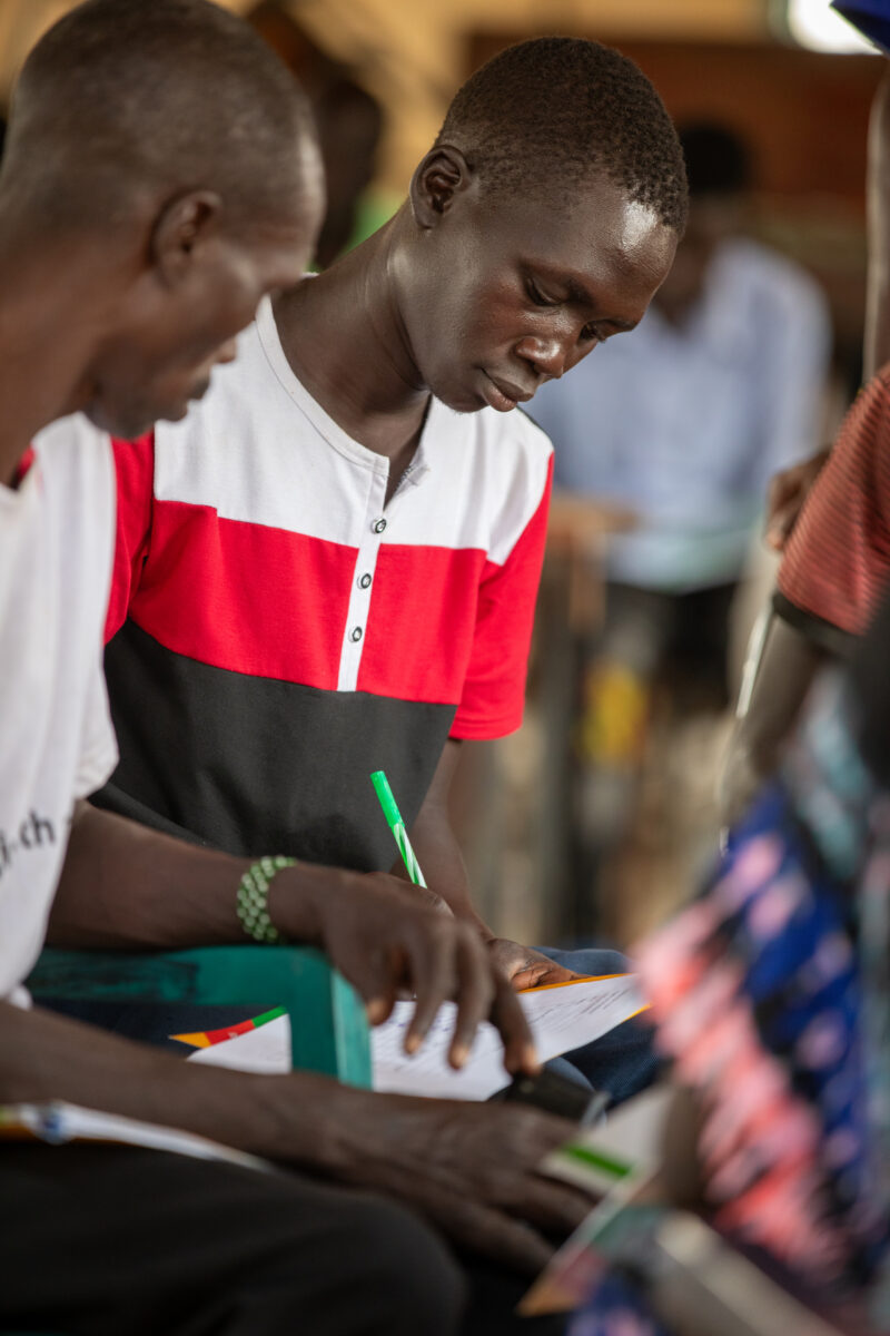 Teacher Training — Teachers go back to school to learn new methods of teaching in rural South Sudan. — Group, Person, Profile Face, Text, Two Faces