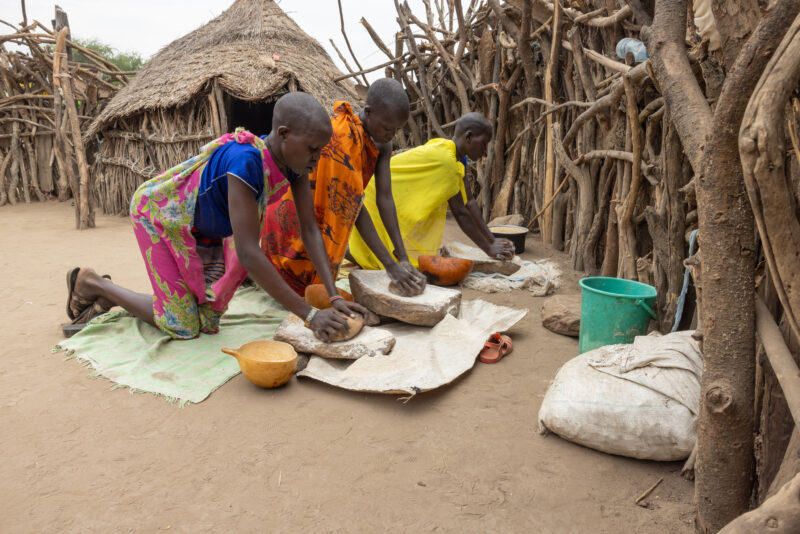 Grinding Grain — To make food easier to cook, it needs to be ground into flour — Person, Profile Face, South Sudan, Two Faces, Africa