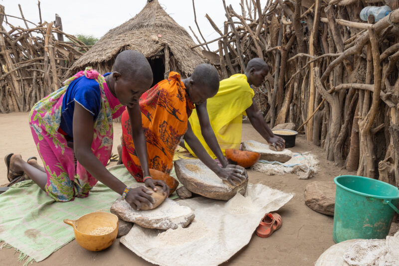 Grinding Grain — To make food easier to cook, it needs to be ground into flour — Person, Profile Face, South Sudan, Two Faces, Africa