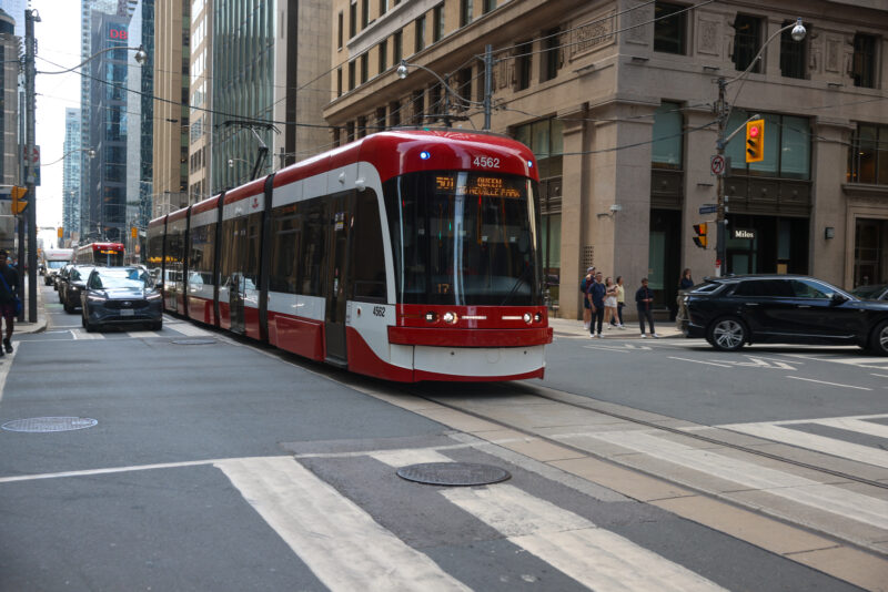Street Car in Toronto — Powered by overhead electric wires, the street cars of Toronto provide clean transportation for the people of Toronto. — Car, Person,...