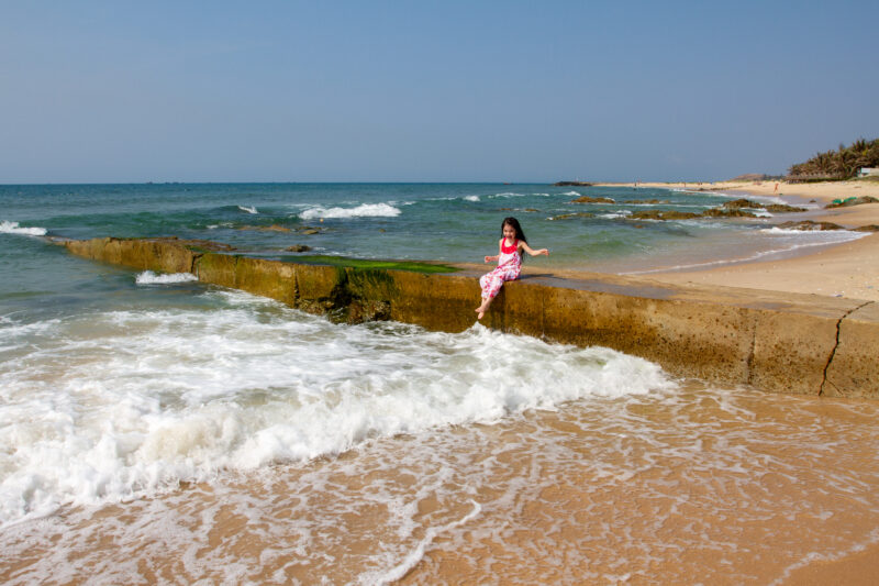 Girl at the Beach — Young girl plays on the beach in Vietnam — Beach, Nature, Ocean, Person, Sand