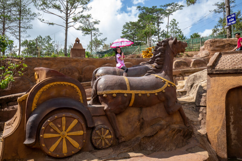 Sculpture Tunnel — Unique sculptures make for fun photos, near Da Lat, Vietnam. — Child, Eyes Open, Female, Frontal Face, One Face