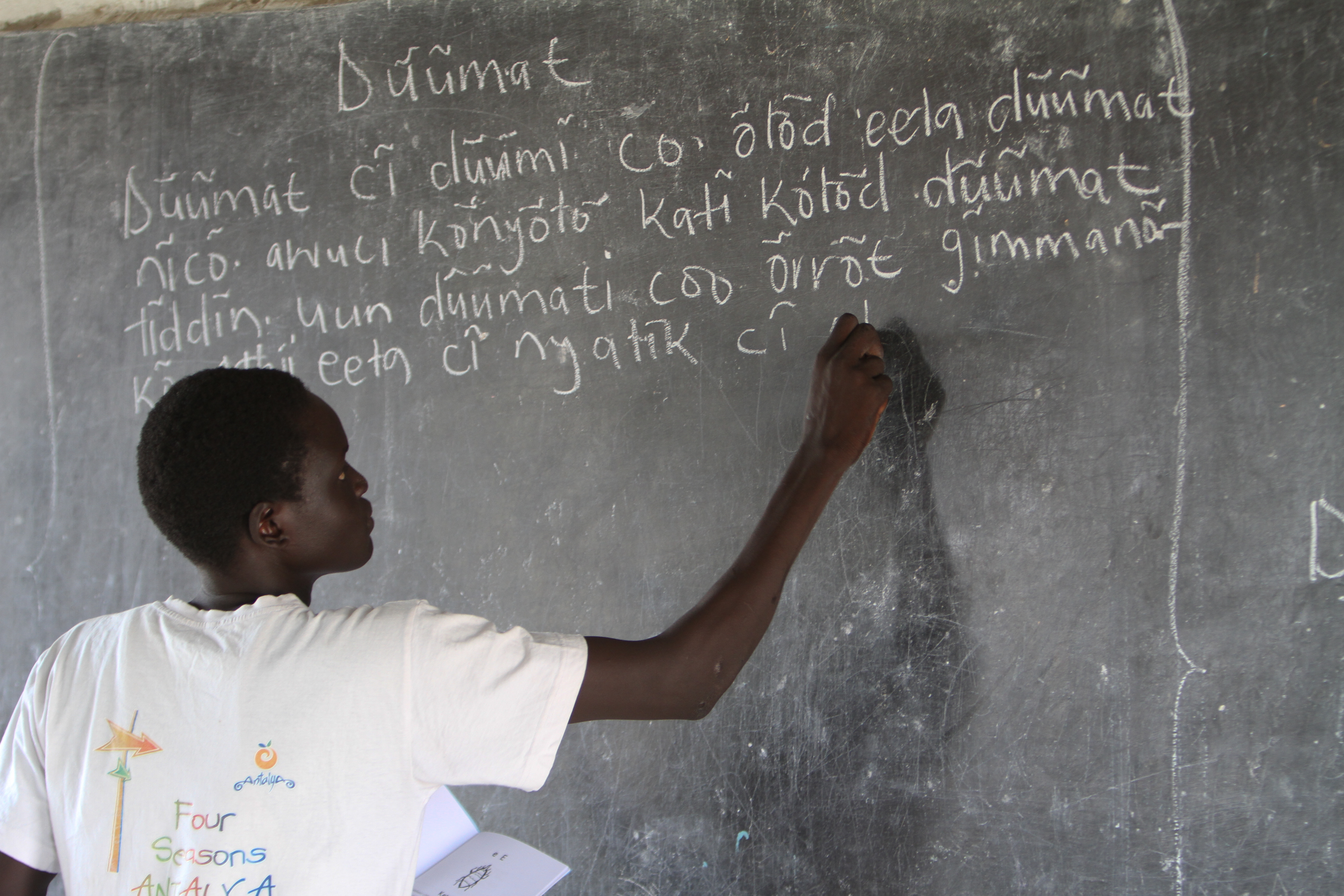 Teacher At Blackboard