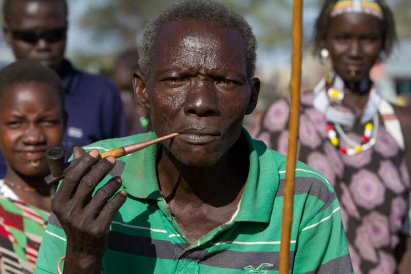 Man in South Sudan smokes A Pipe